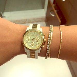 White and gold Michael Kors watch.